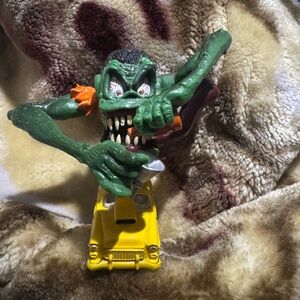 Monster Action Figure on Yellow Car